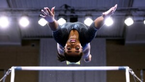 Simone Biles mid-air Yurchenko double pike with chalk explosion
